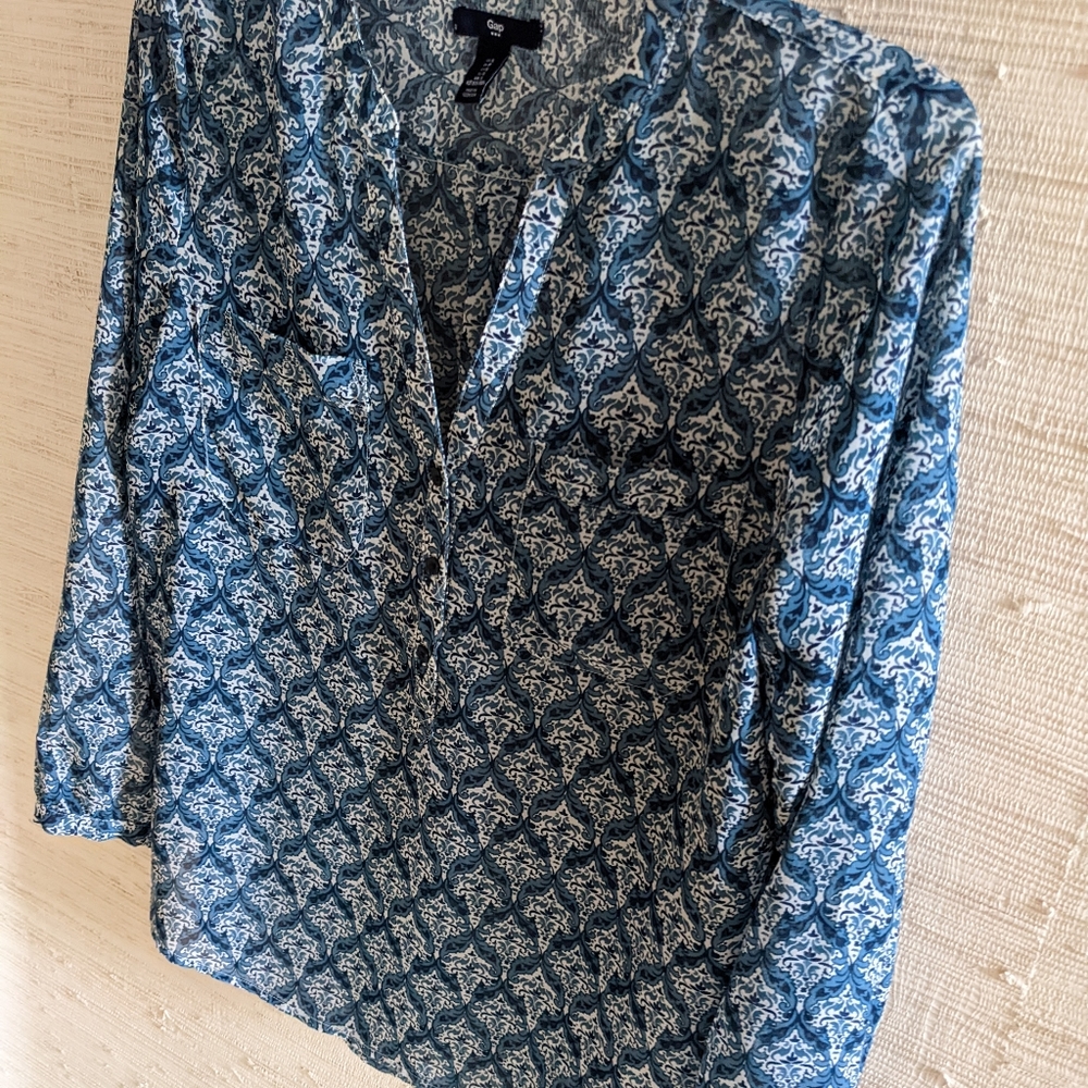 Gap size small blue floral semi sheer blouse long sleeves.